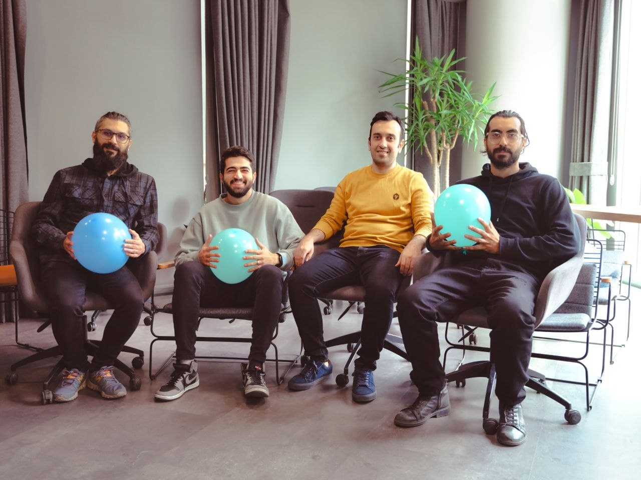 Mofid team celebration with blue balloons